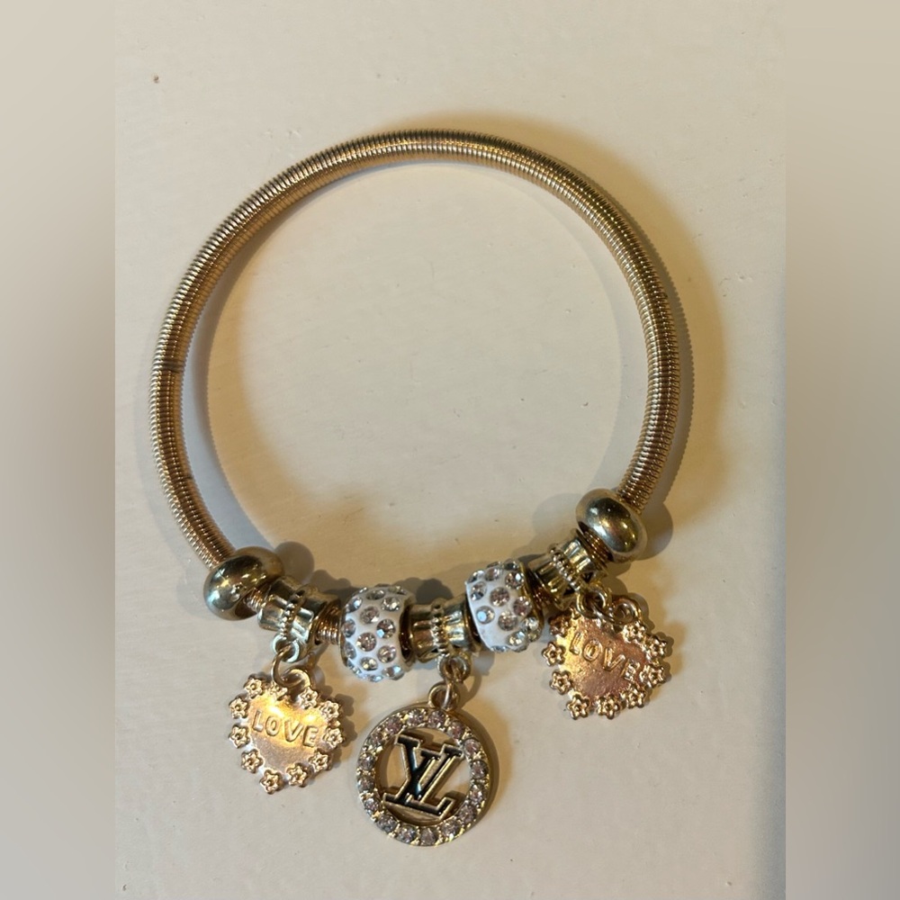 Genuine Louis Vuitton LOVE/ AMMOUR bracelet- goldtone. Diamonds